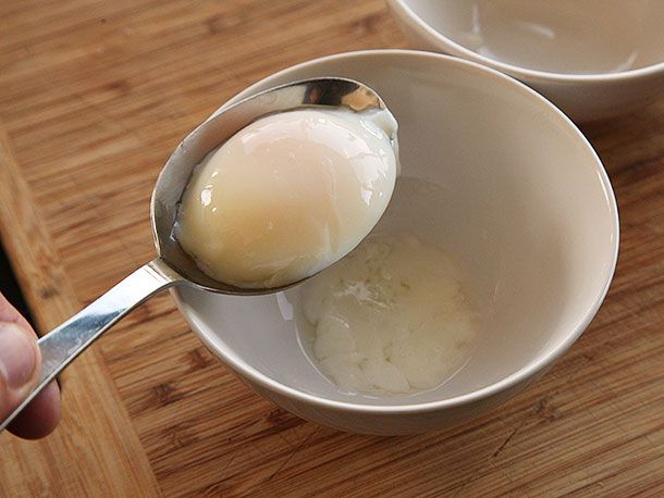 Spoon holding up sous vide poached egg