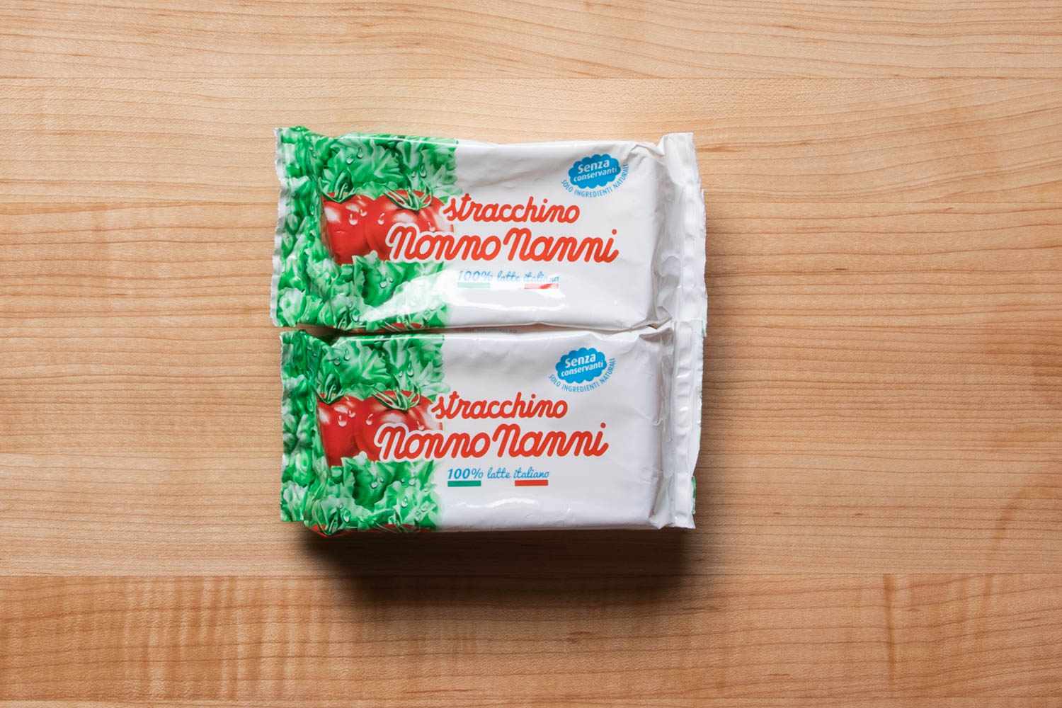 Packages of Stracchino cheese.