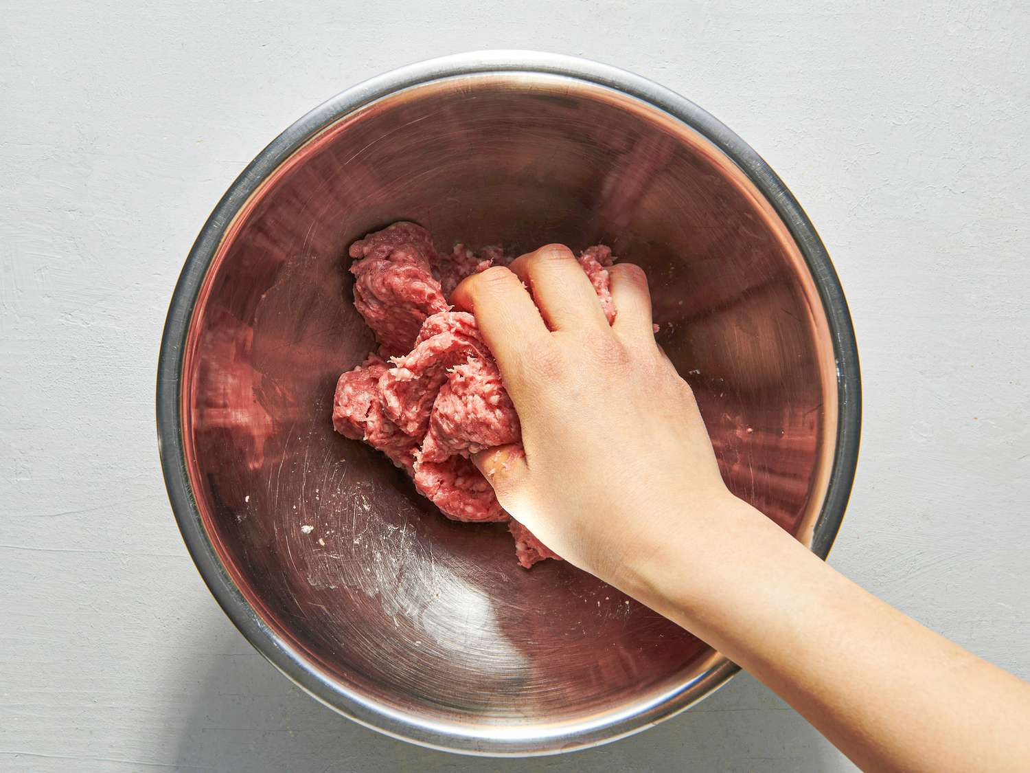 Overehead view of grasping meat