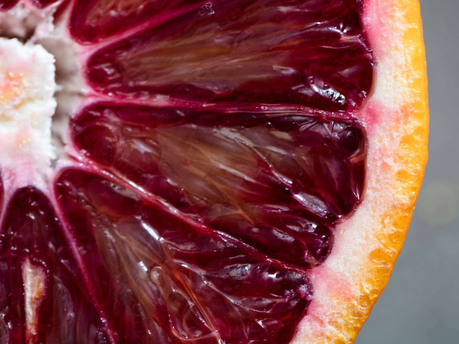 A very close up look at the scarlet interior of the blood orange.
