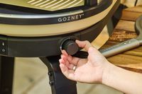 A person turns a dial on the Gozney ARC XL Compact Pizza Oven