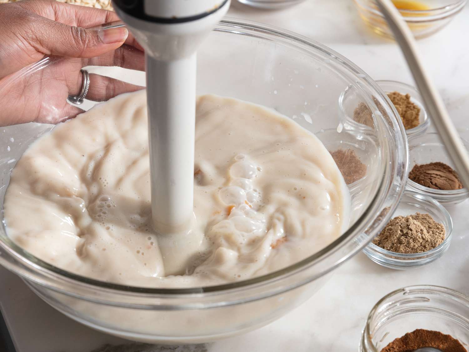 frothing milk with spices with an immersion blender