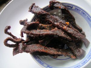 A bowl of homemade beef jerky. 