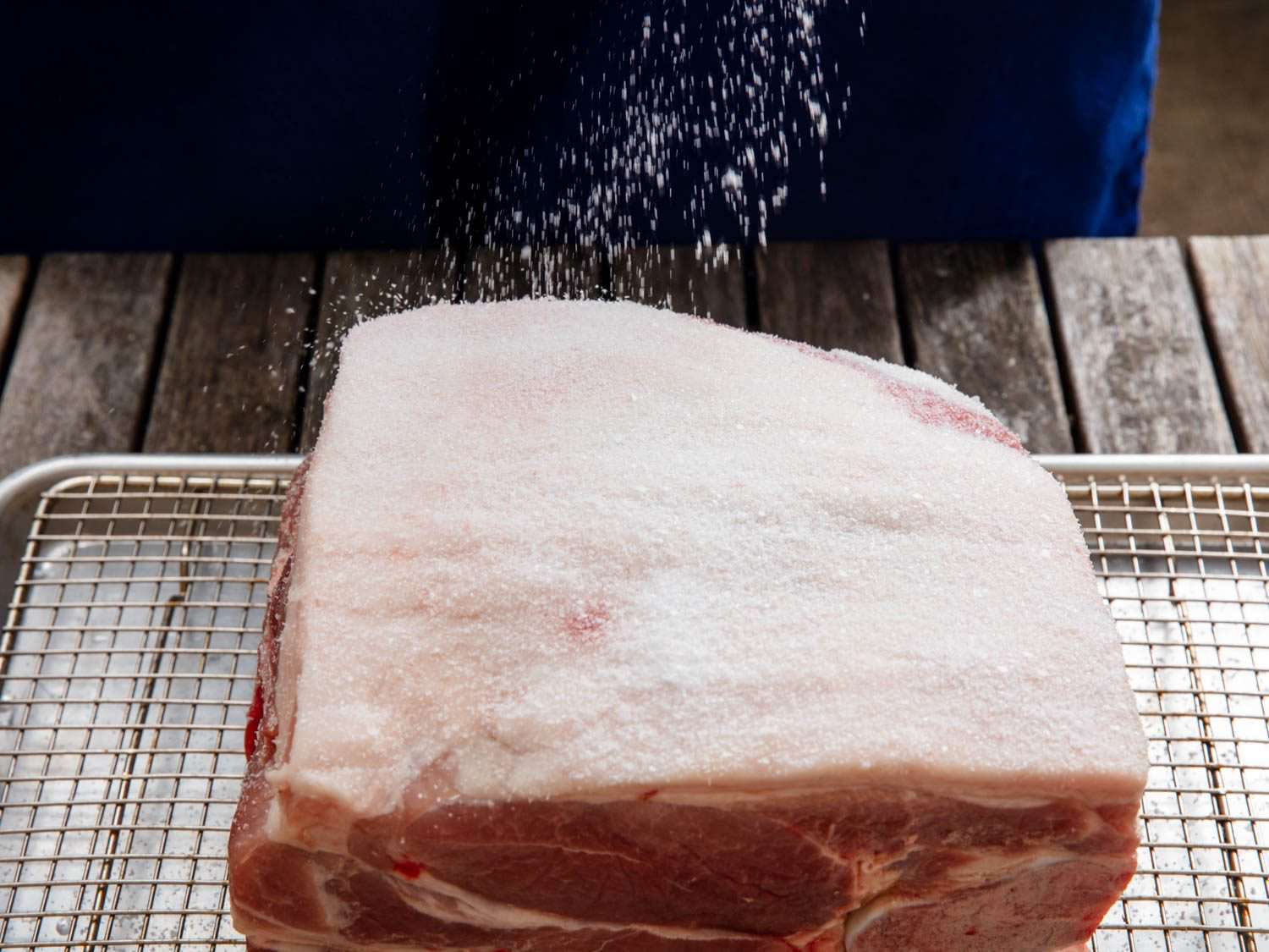 Salting a pork shoulder for a dry-brine