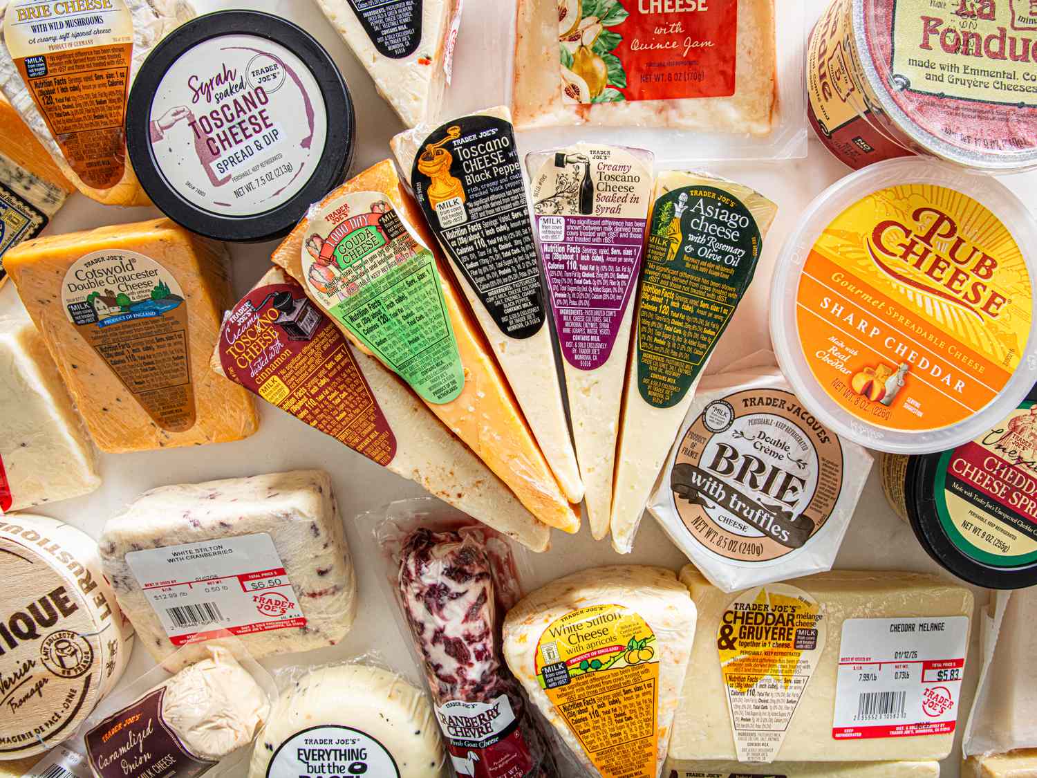 Variety of packaged cheeses displayed together sourced from Trader Joes