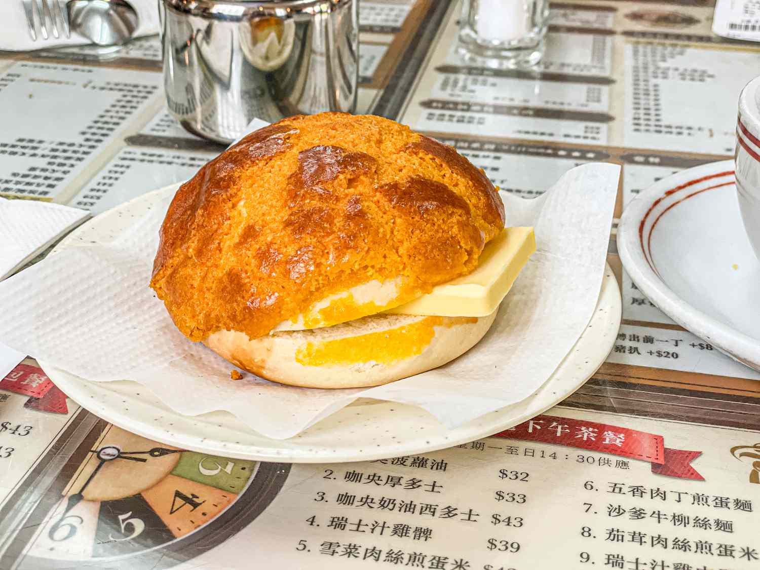 Pineapple bun with a slab of butter at Cheung Hing Coffee Shop