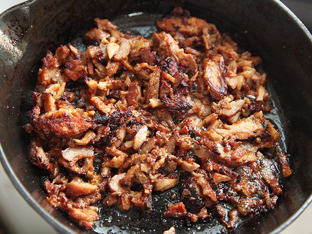 Crisped al pastor taco meat in a cast iron skillet
