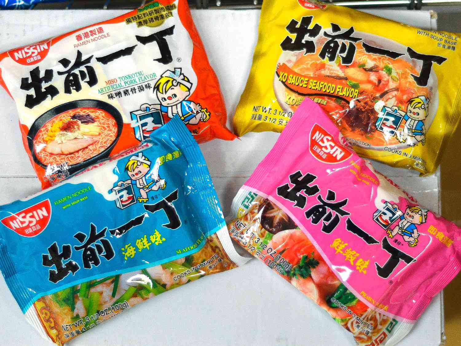 Four packages of different flavored ramen noodles. 