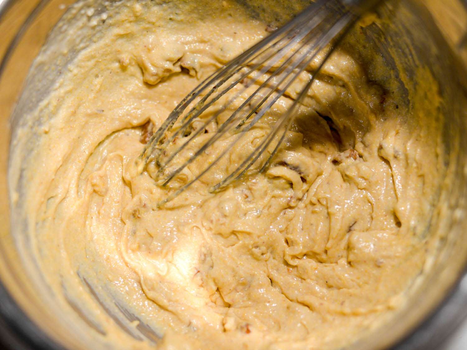 Whisking maple cornbread batter.