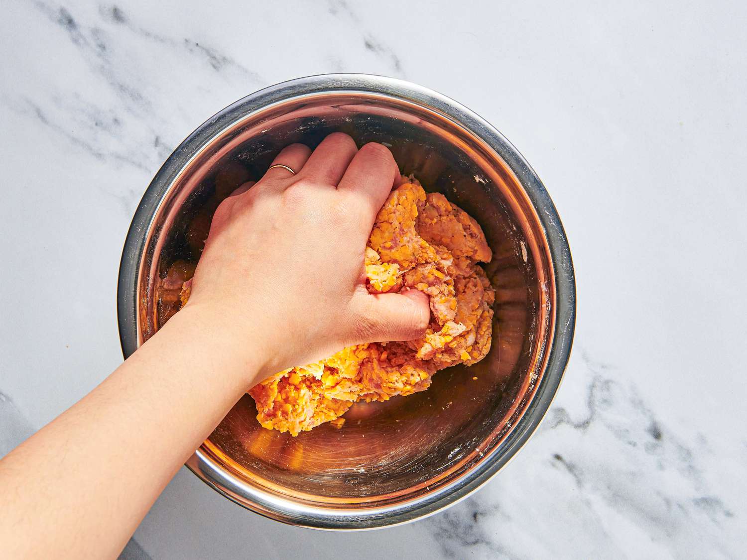 Overhead of mixing sausage and cheese mixture