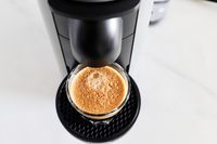 A cup of espresso on the Nespresso VertuoPlus Coffee and Espresso Machine by De'Longhi