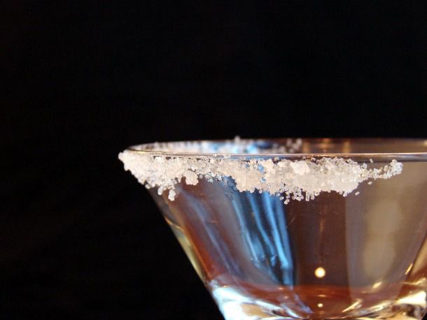 Sugar on the rim of a cocktail glass. 