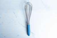 Misen Stainless Steel Whisk on a marbled surface