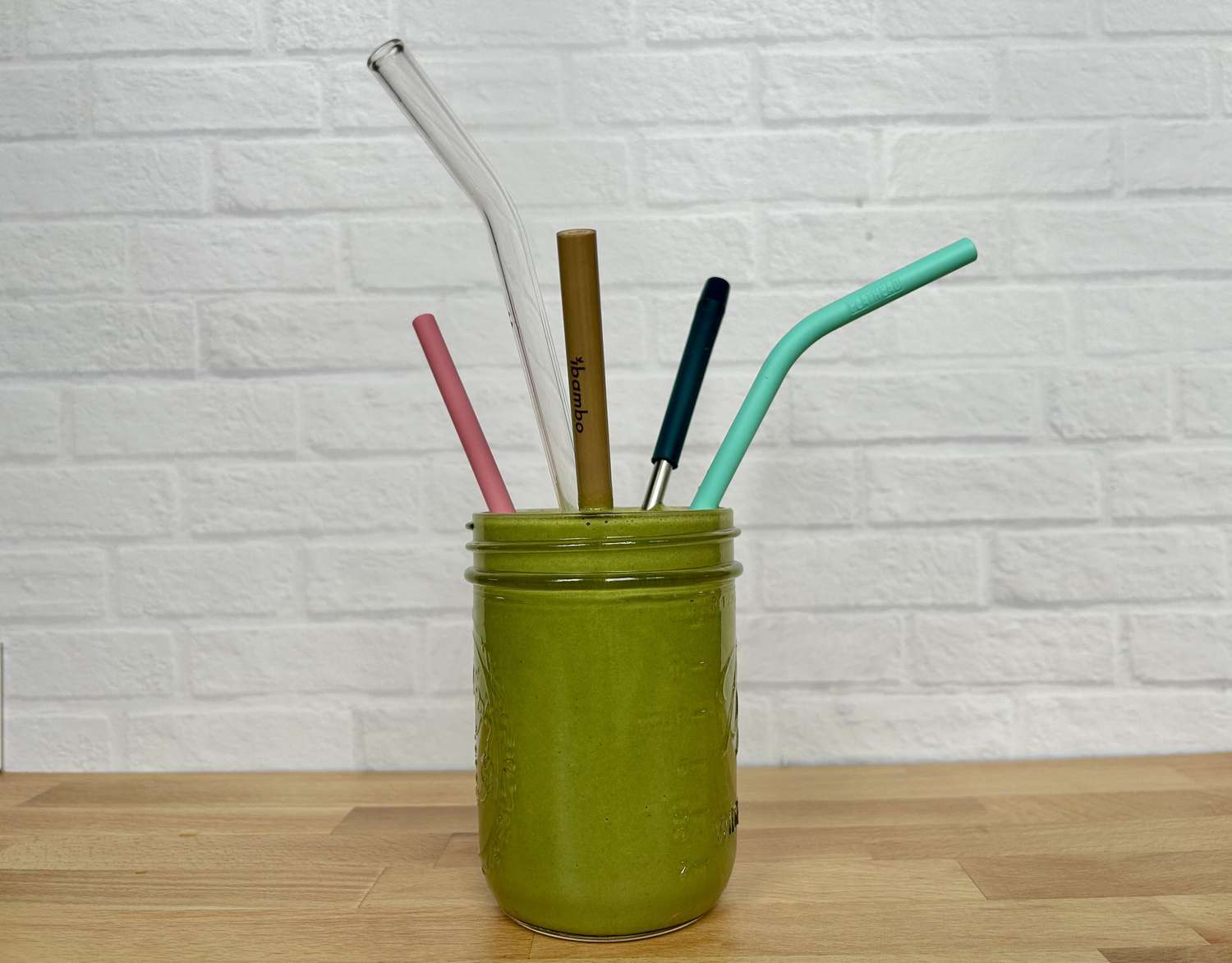 A collection of glass straws in a smoothie