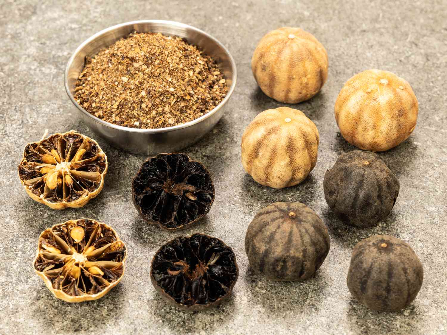 Persian Lemons and herbs on a stone surface 