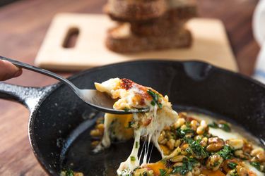sagnaki with walnut vinaigrette in a cast iron skillet