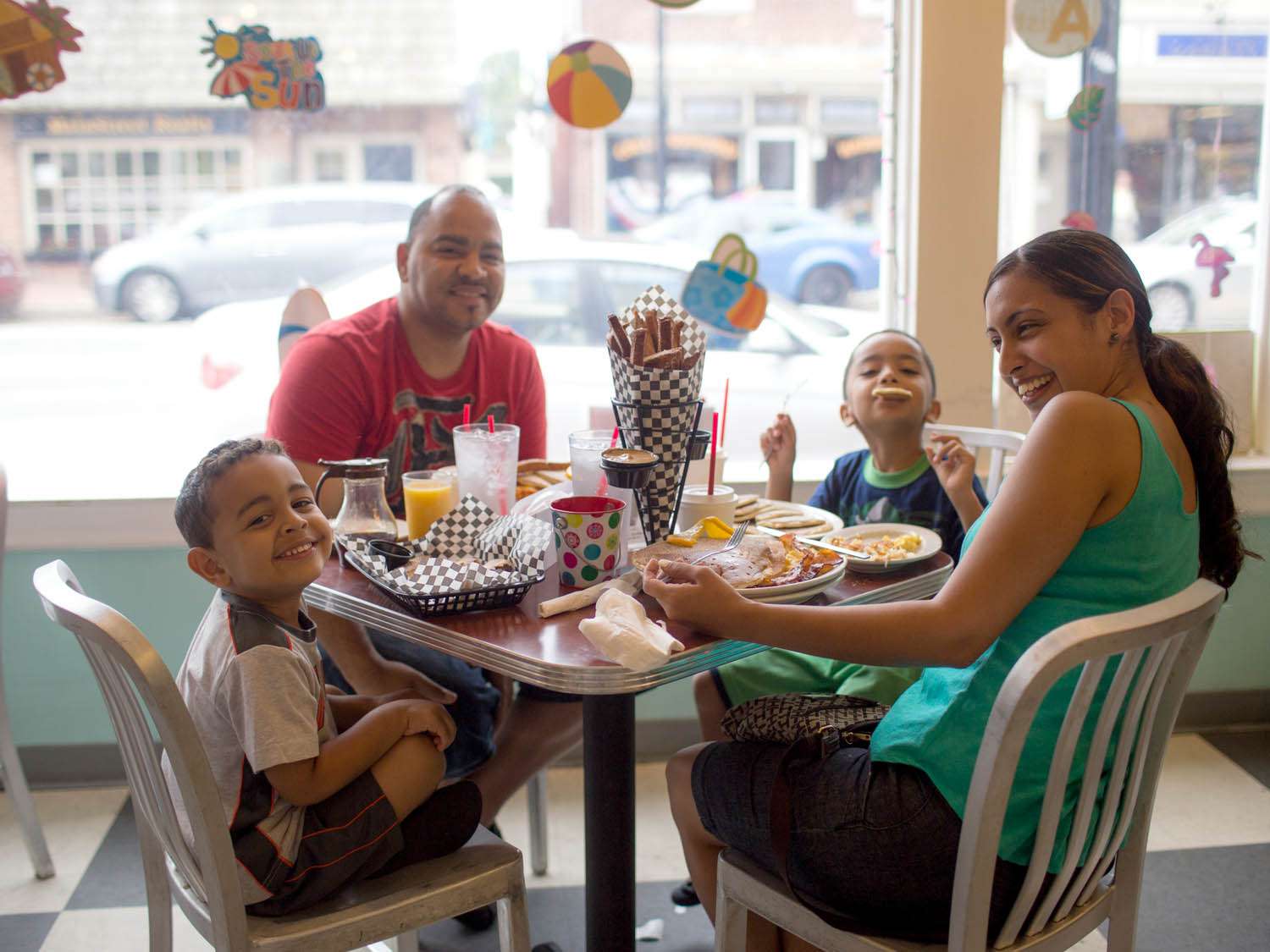 Family eating a meal at the Pop Shop in Philadelphia.