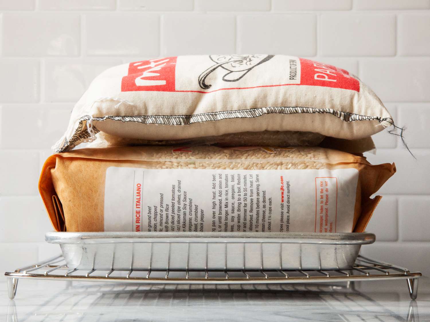 Weighing down a cooling rack with bags of rice to see if it warps. 
