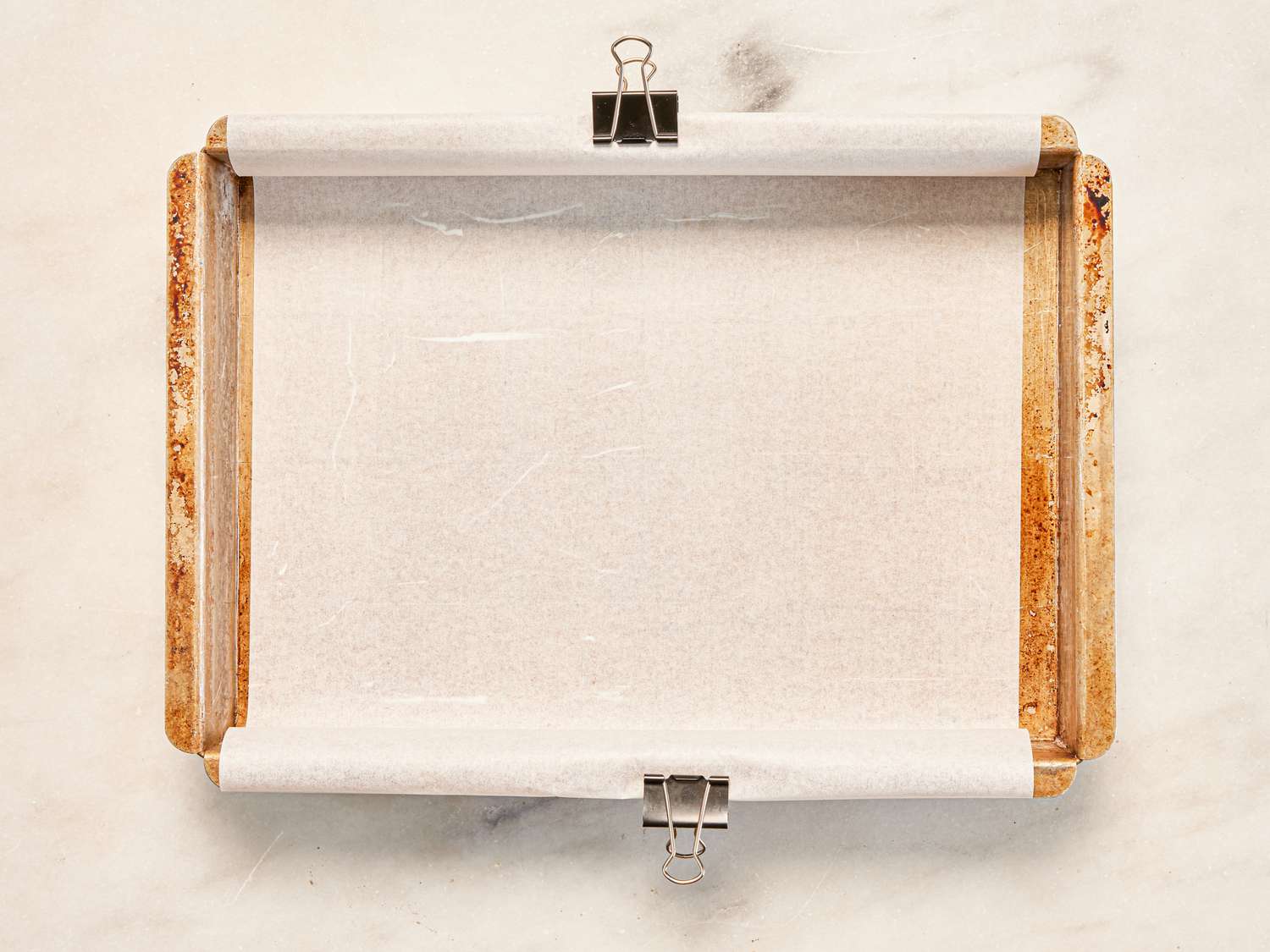 Overhead of baking tin lined with parchment paper