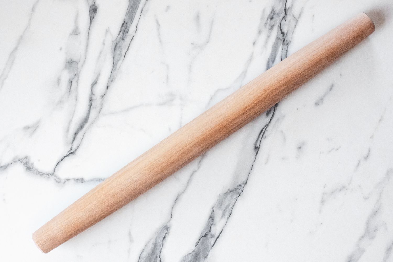 J.K. Adams Maple French Rolling Pin on a marble surface