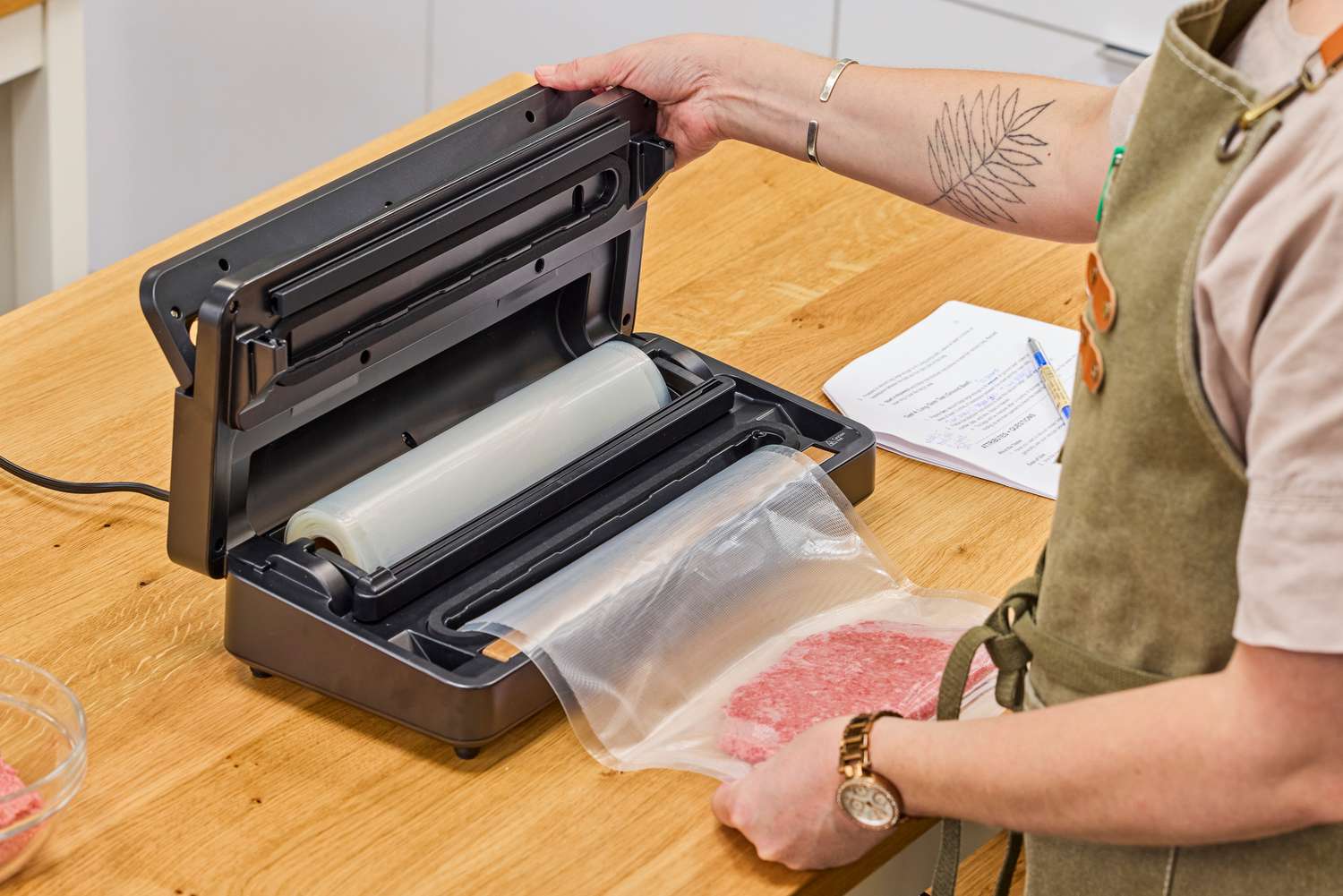 The Anova Precision Vacuum Sealer Pro is used to seal meat