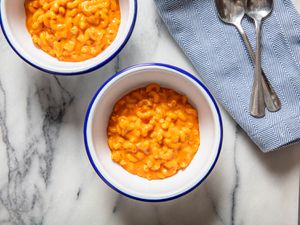 Overhead shot of two bowls of stovetop mac and cheese with 'nduja