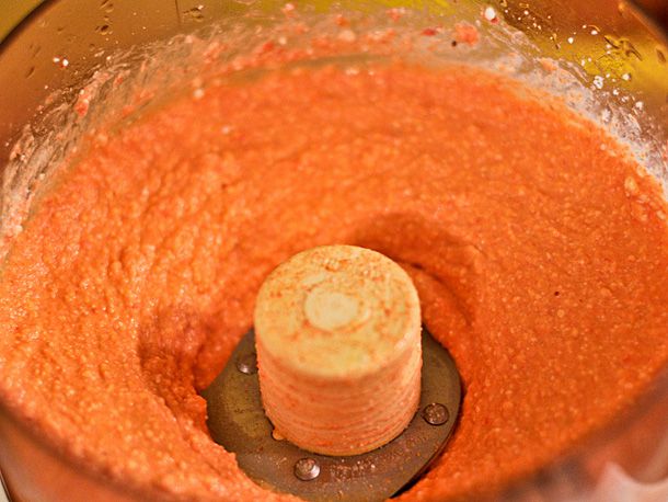 The finished tyrokafteri in the bowl of a food processor, ready to be transferred and served.