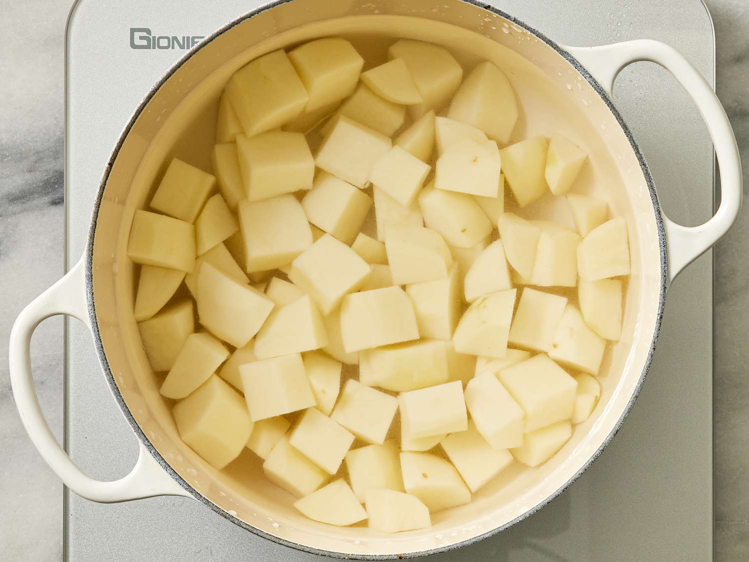 Overhead view of potatoes cooking