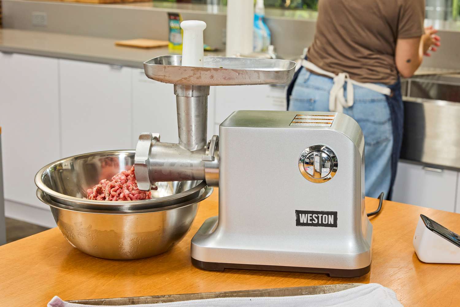 Weston #12 Electric Meat Grinder & Sausage Stuffer displayed on counter top