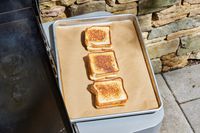 Three grilled cheeses cooked on the Weber 36 Inch Gas Griddle