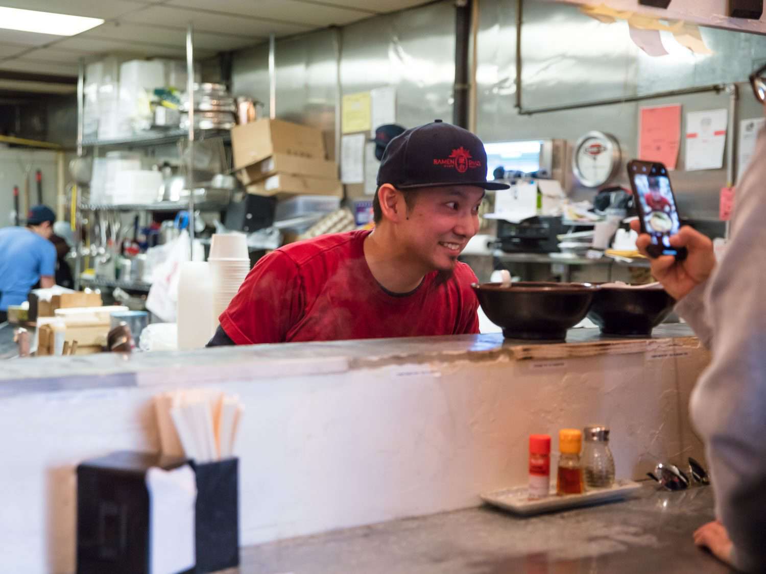 Keizo Shimamoto posing for a picture at Ramen Shack