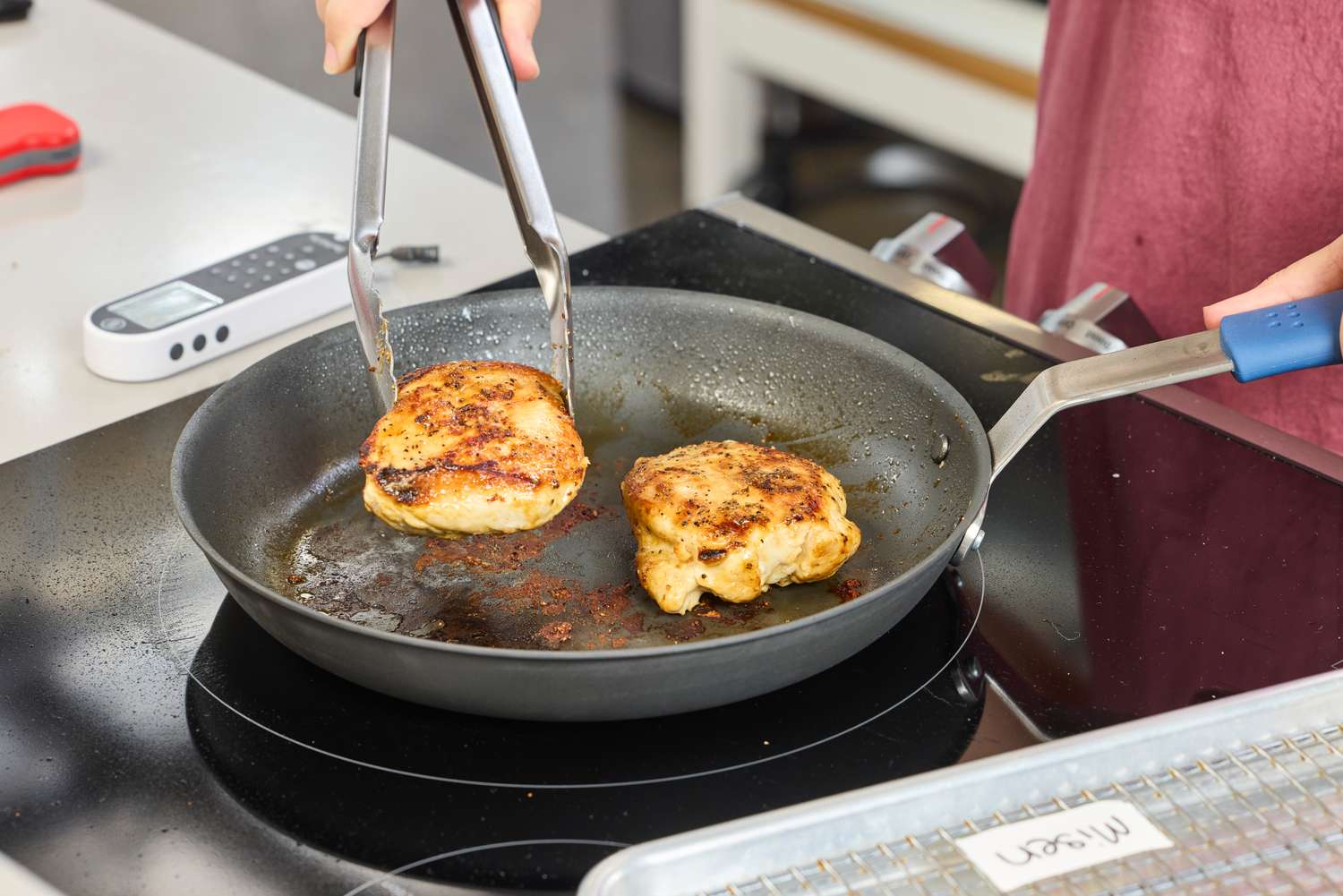 Chicken is cooked in the Misen Pre-Seasoned 10 Inch Carbon Steel Pan