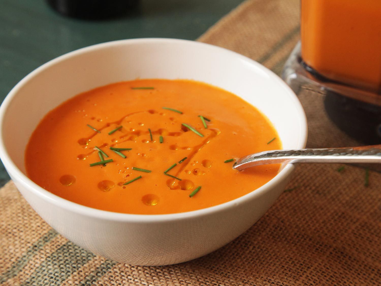 15-minute blender tomato soup in white bowl with spoon