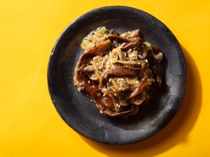 Overhead of a small plate of marinated eggplant banchan