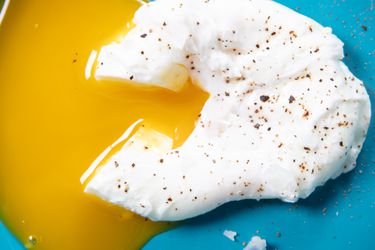 Overhead view of a cut poached egg