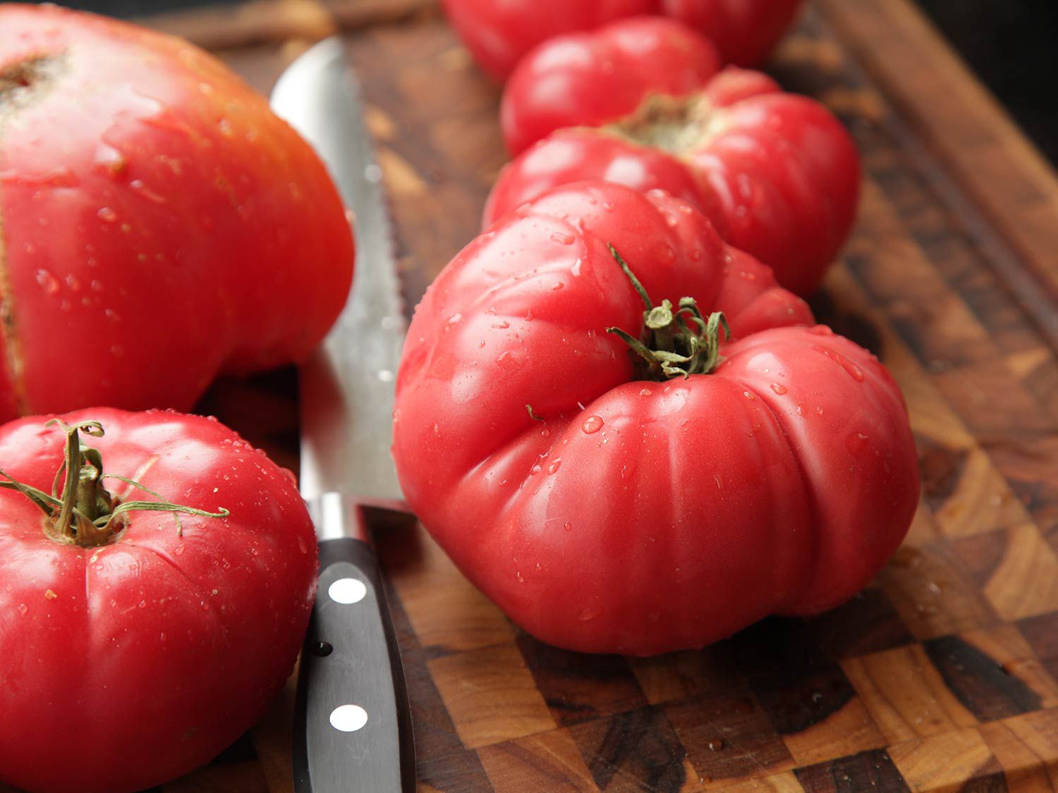 Tomatoes on a cutting board. 