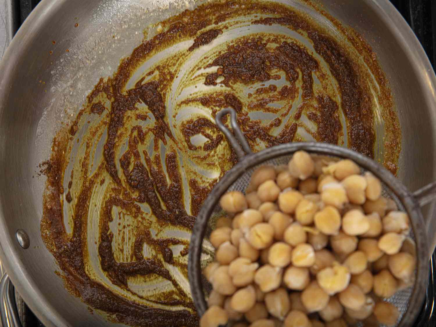 Overhead view of adding chickpeas