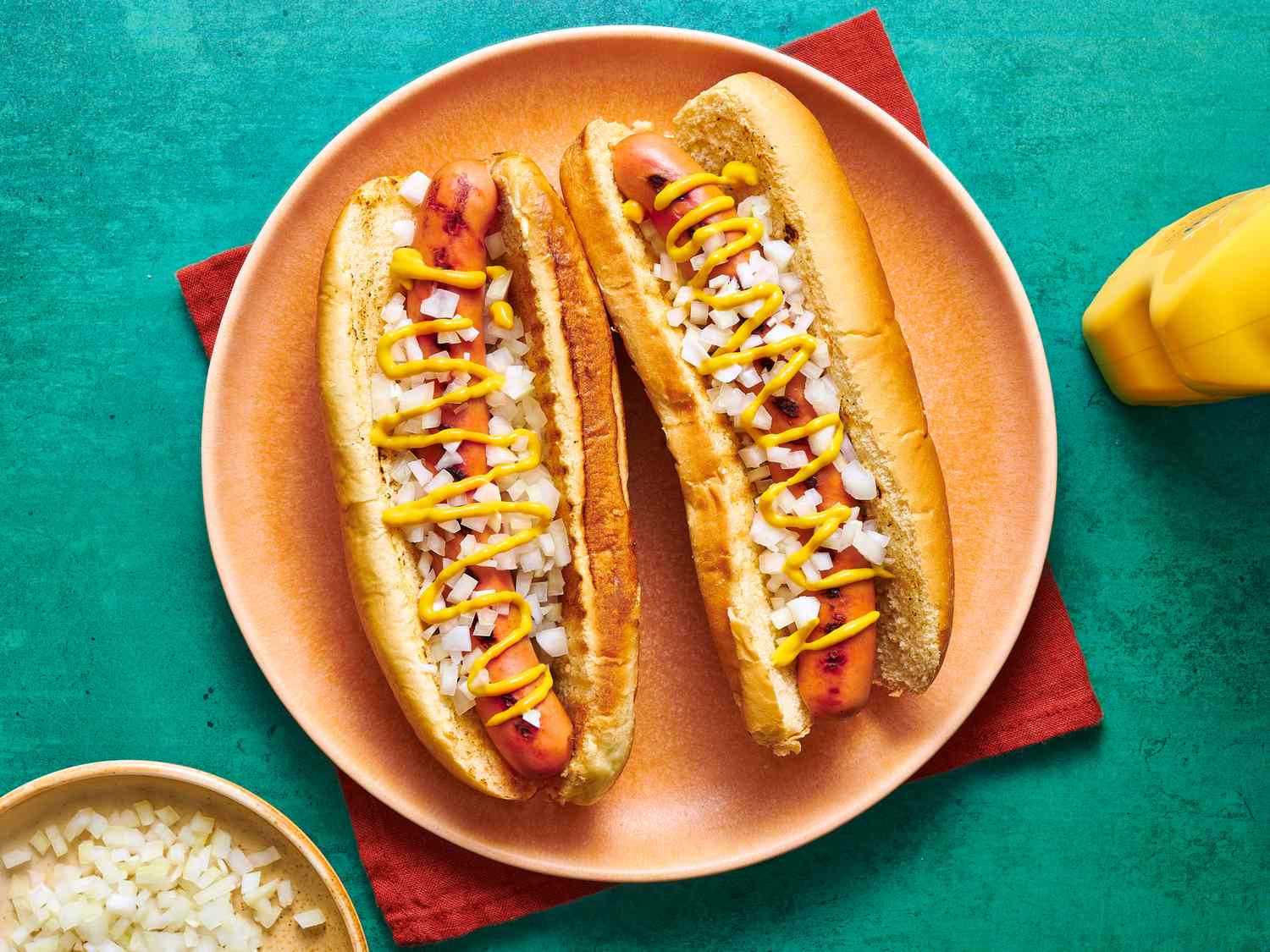 Overhead view of two hot dogs on a plate