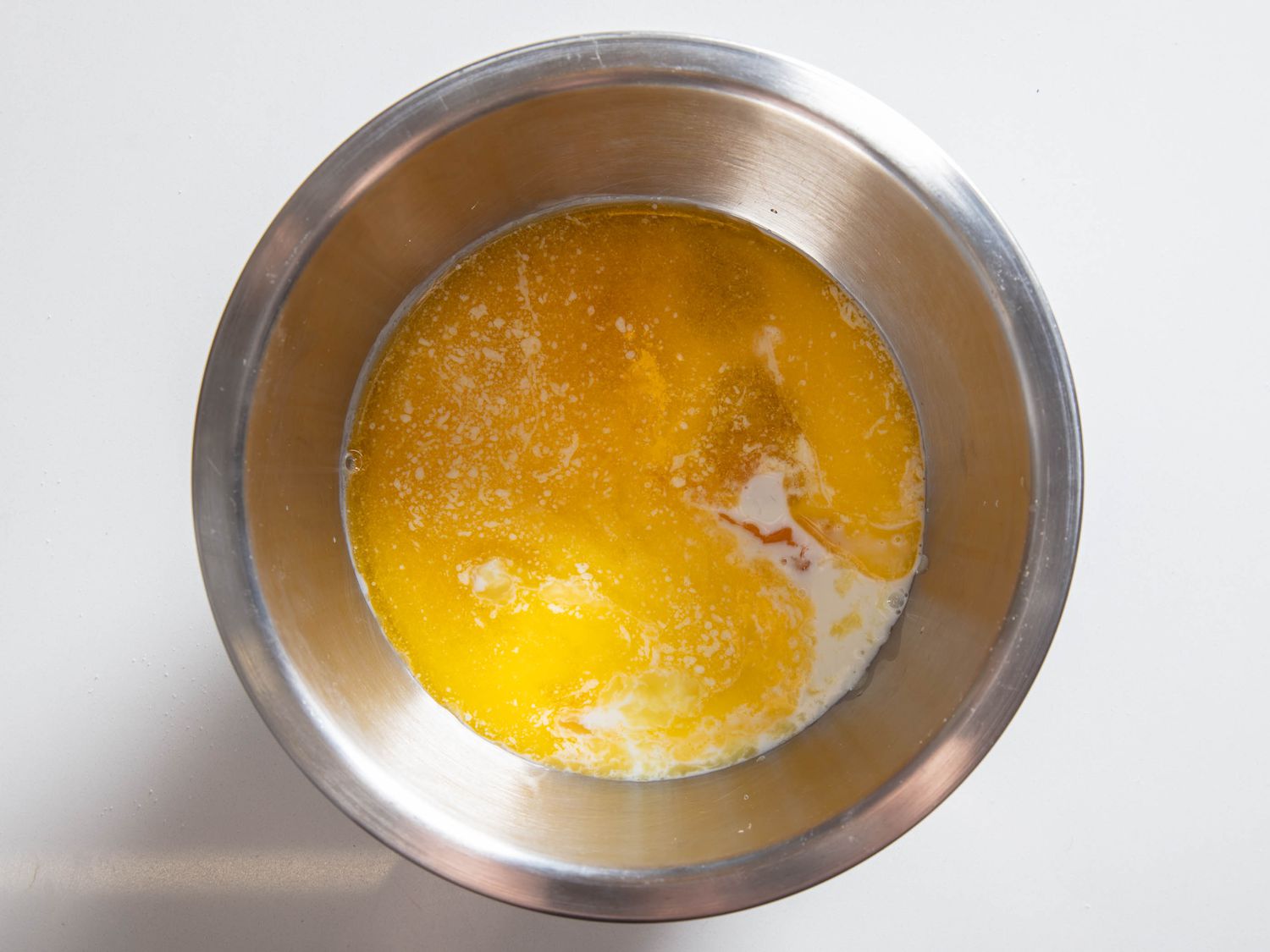 Wet mix for cornbread muffins in a bowl