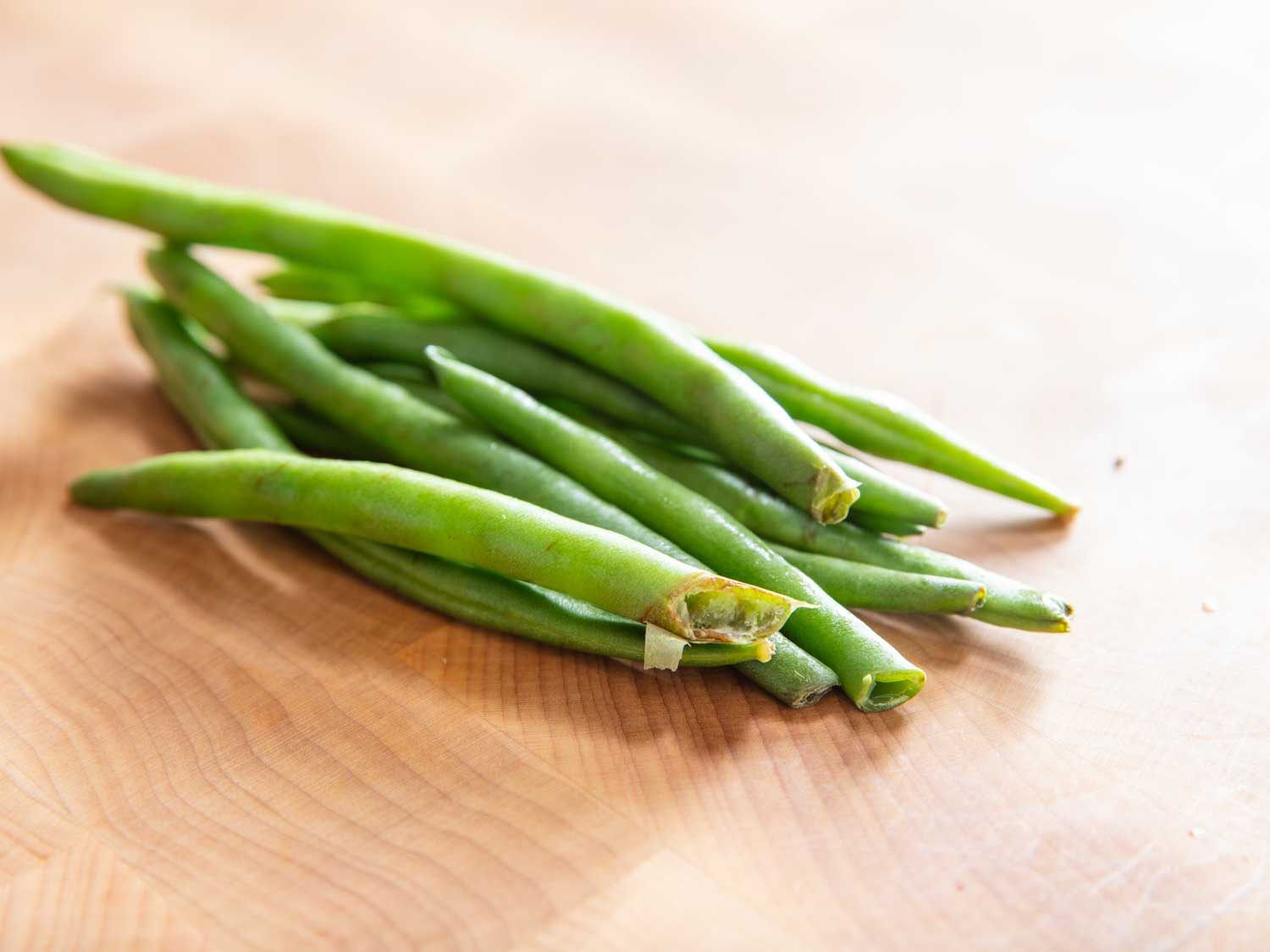 Green beans with damaged stem ends.