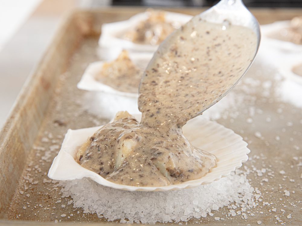 Side view of spooning onto scallops