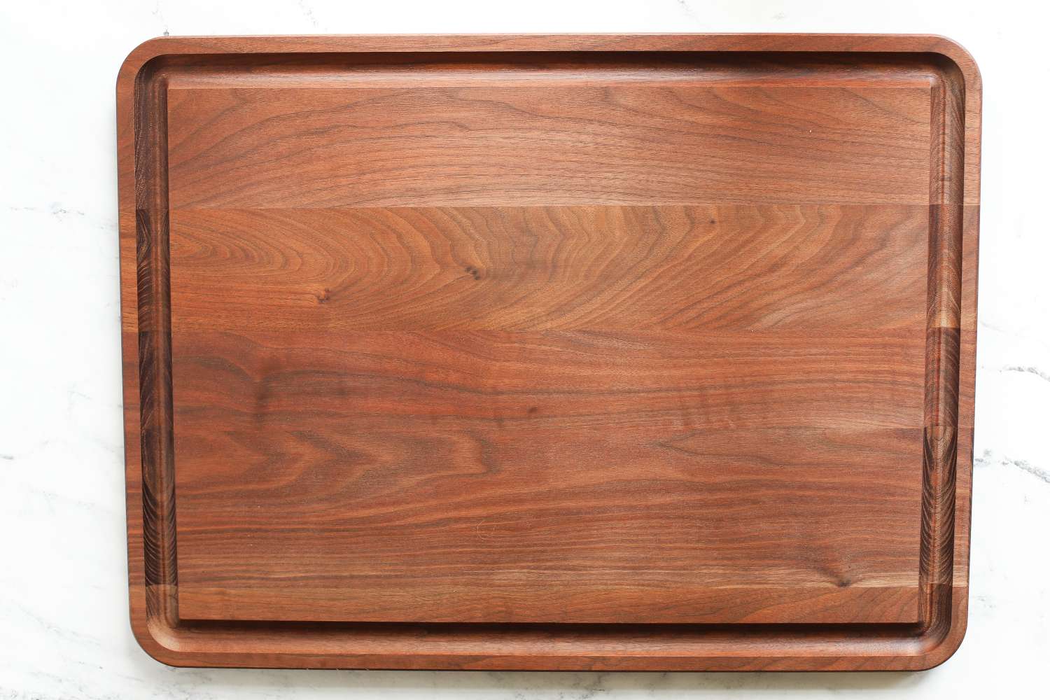 Virginia Boys Kitchens Walnut Wood Cutting Board with a carved groove along the edge