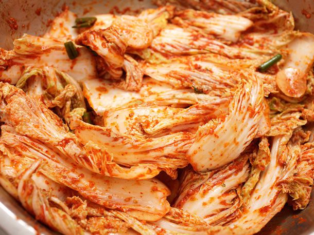 The vegetables are thoroughly coated with the chile paste.