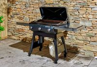The Traeger Flatrock Flat Top Grill outside on a patio