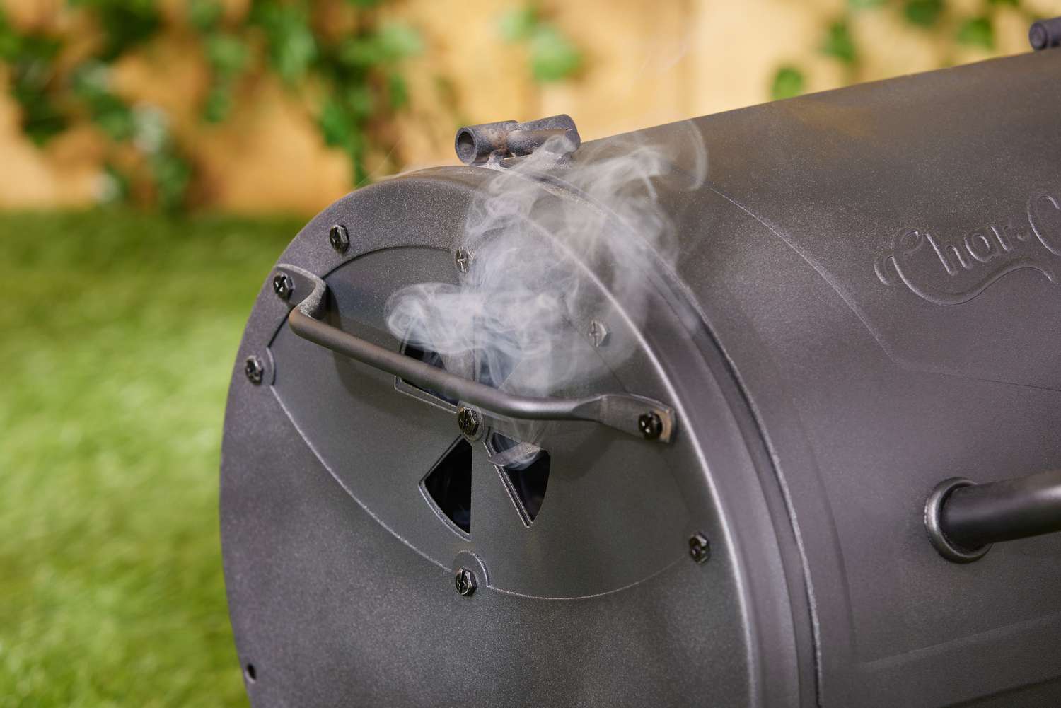 Smoke coming out of the Char-Griller grill.