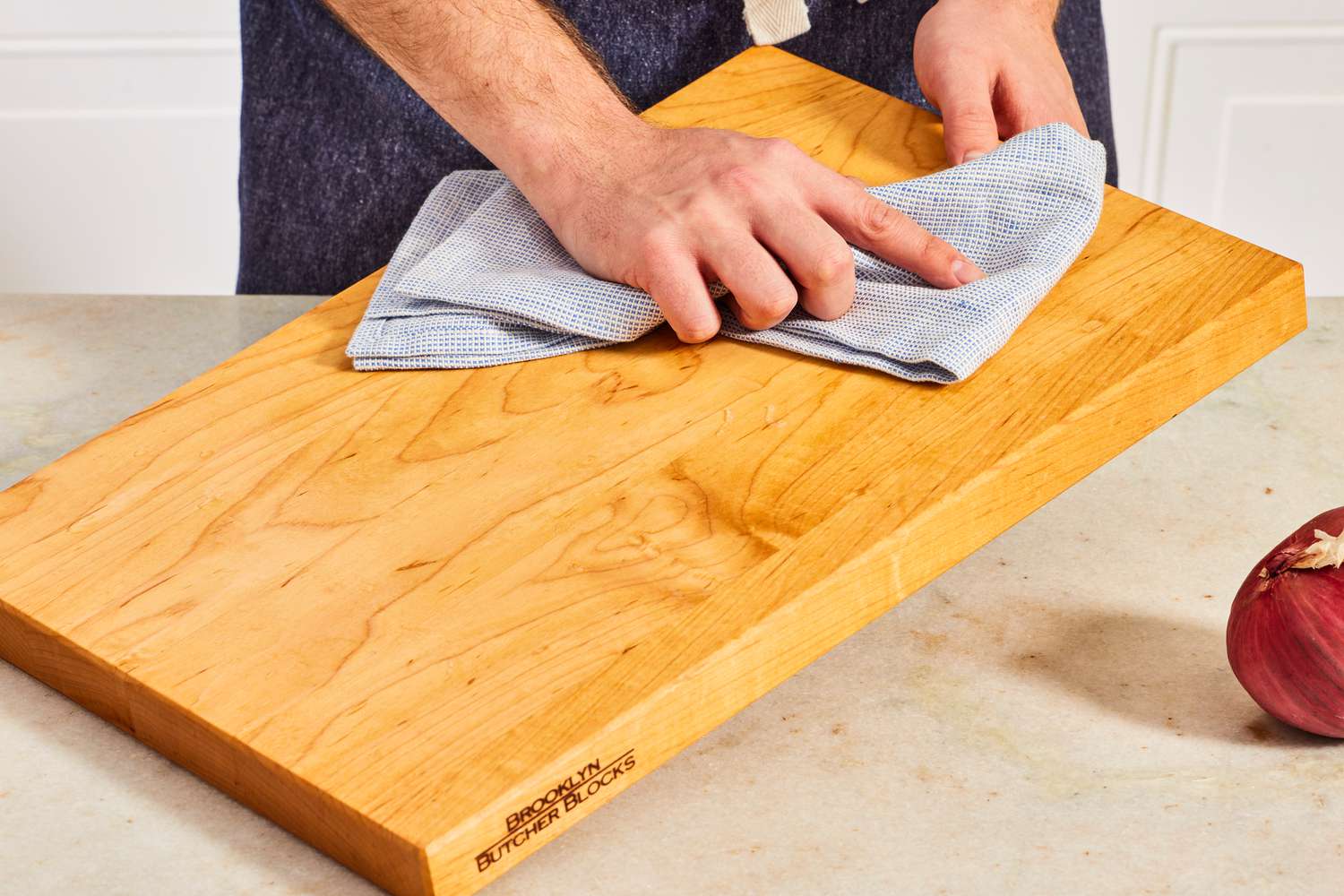 wiping down a cutting board 