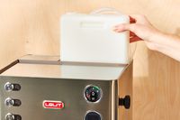 A person adjusting one part of the Lelit Elizabeth Espresso Machine