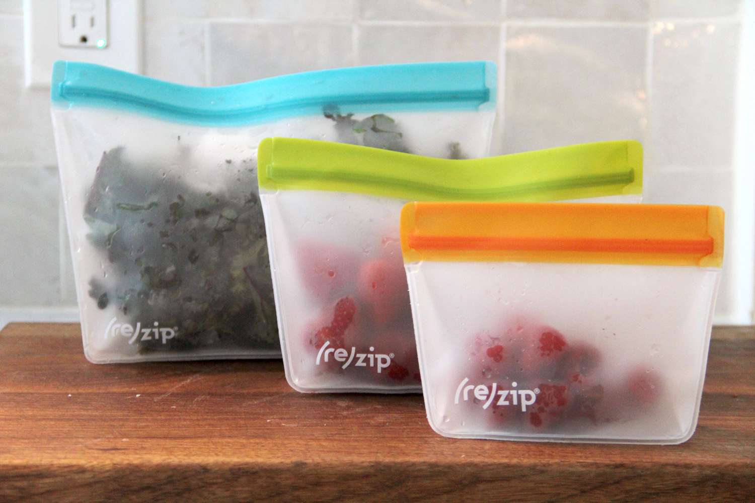 Reusable food storage bags on a wooden countertop