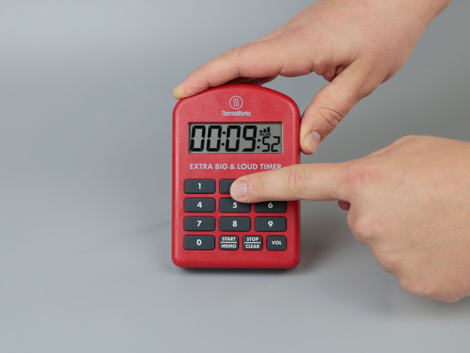the thermoworks big and loud timer with someone using it 