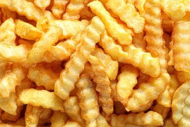A closeup of crinklecut French fries